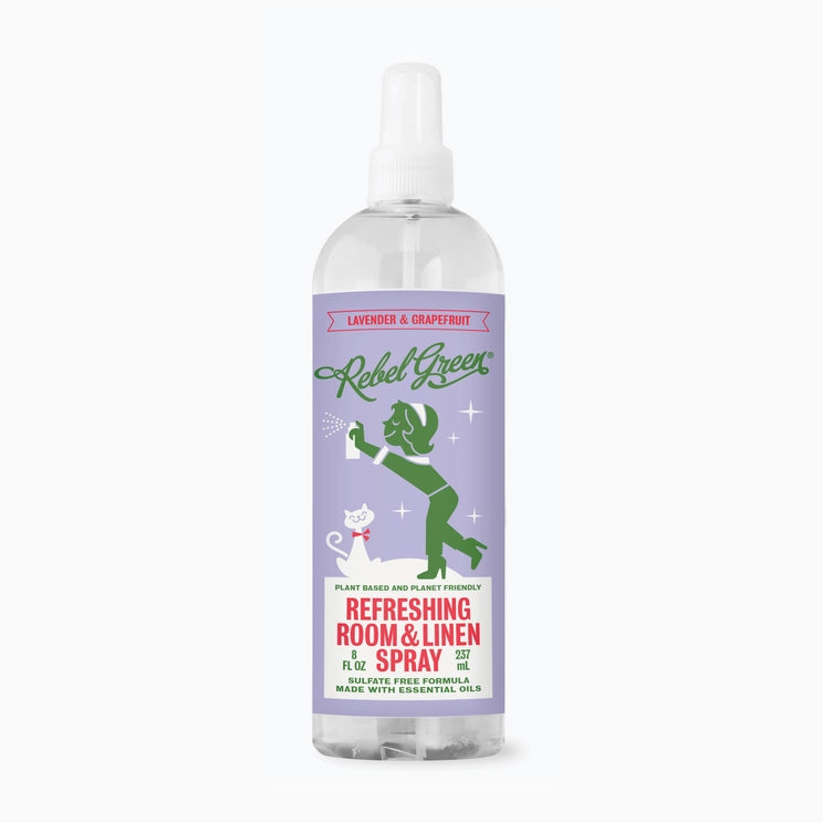Image of 8 once bottle of Rebel Green room and linen spray in lavender & grapefruit scent. The label is purple and green with a vintage theme.