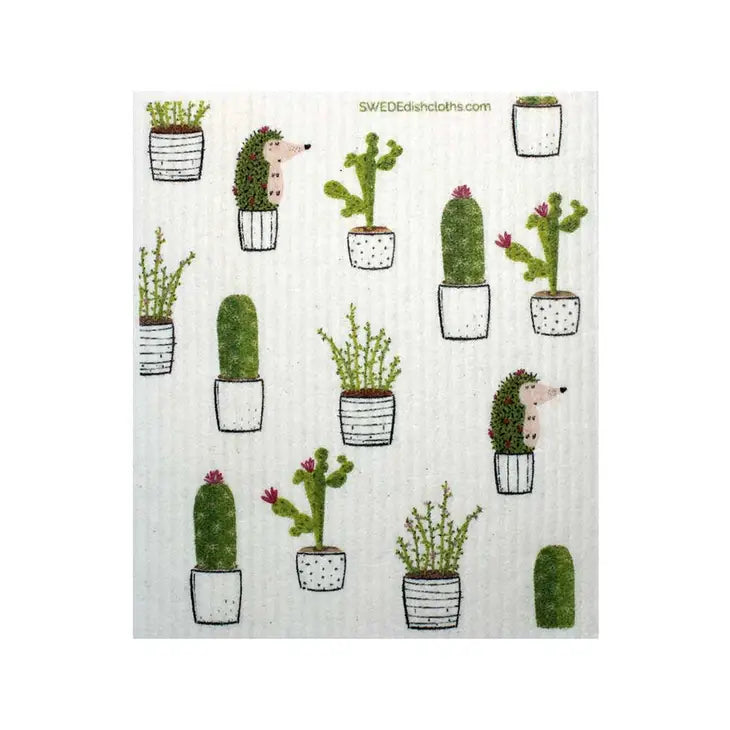 Image of White Swedish dishcloth printed with various cactus plants and a hedgehog disguised as a cactus.