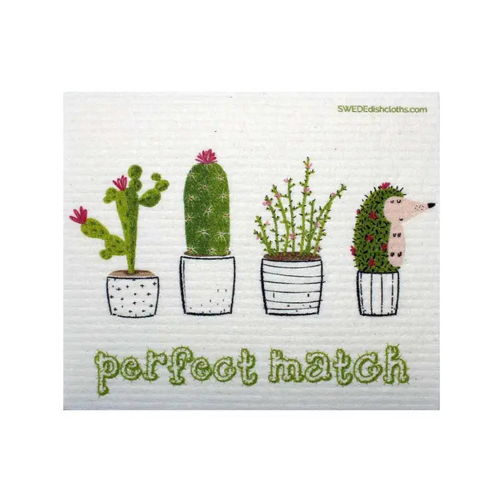 Image of white Swedish dishcloth printed with the words "Perfect Match" and 4 different potted cactus plants, one is a hedgehog disguised as a cactus.