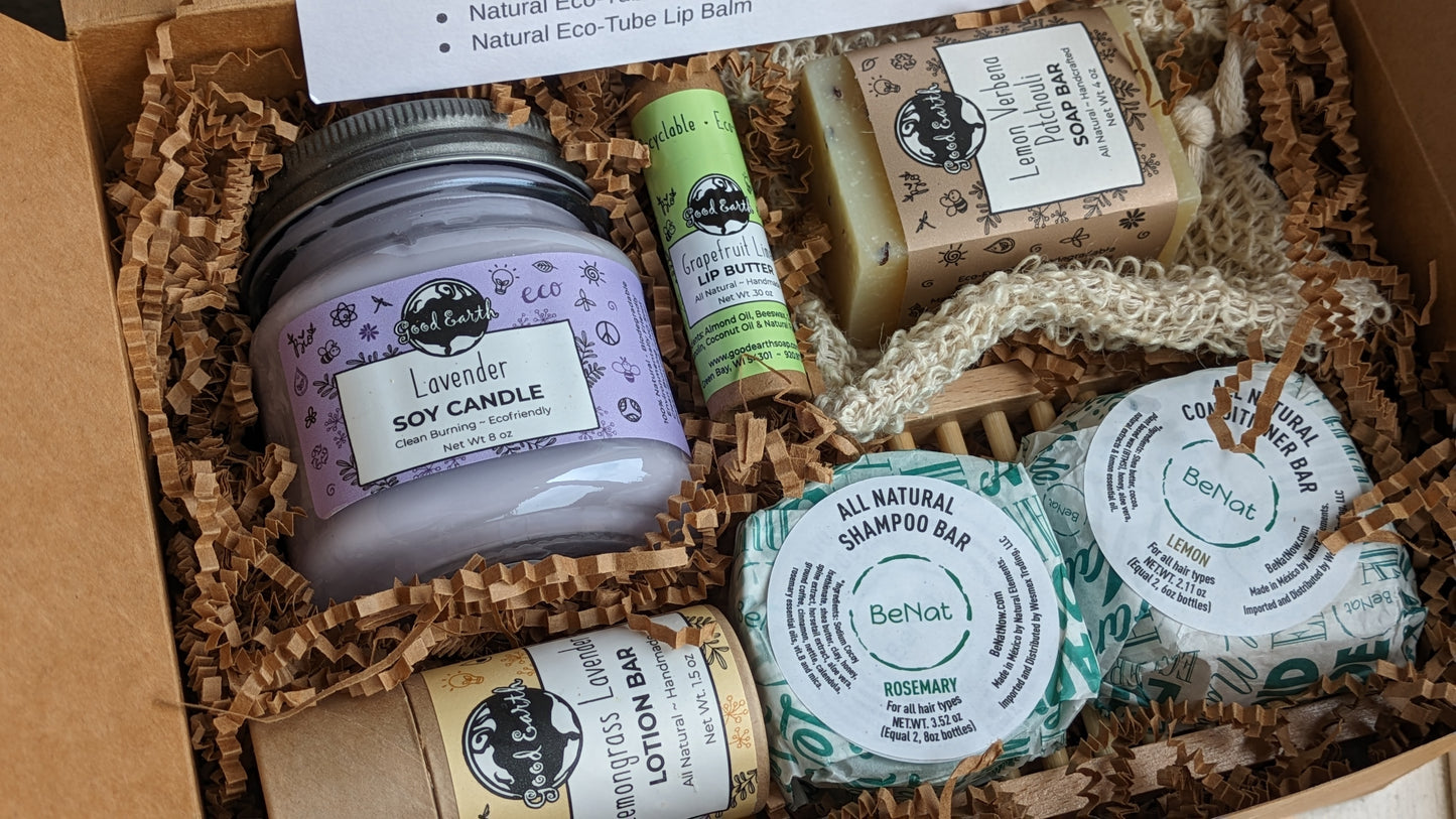 Six eco-friendly products bundled to make the perfect gift for anyone. (Scents and flavors with vary based on availablity.) Clean burning soy candle in recyclable mason jar, zero waste shampoo and conditioner bars with bamboo tray, natural soap bar with machine washable soap saver bag that is soft enough to use as a wash cloth and compostable at the end of its life, natural eco-tube lotion bar, and a natural eco-tube lip balm.