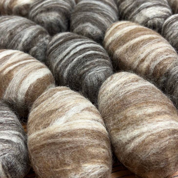 Image of various felted soaps in natural colors
