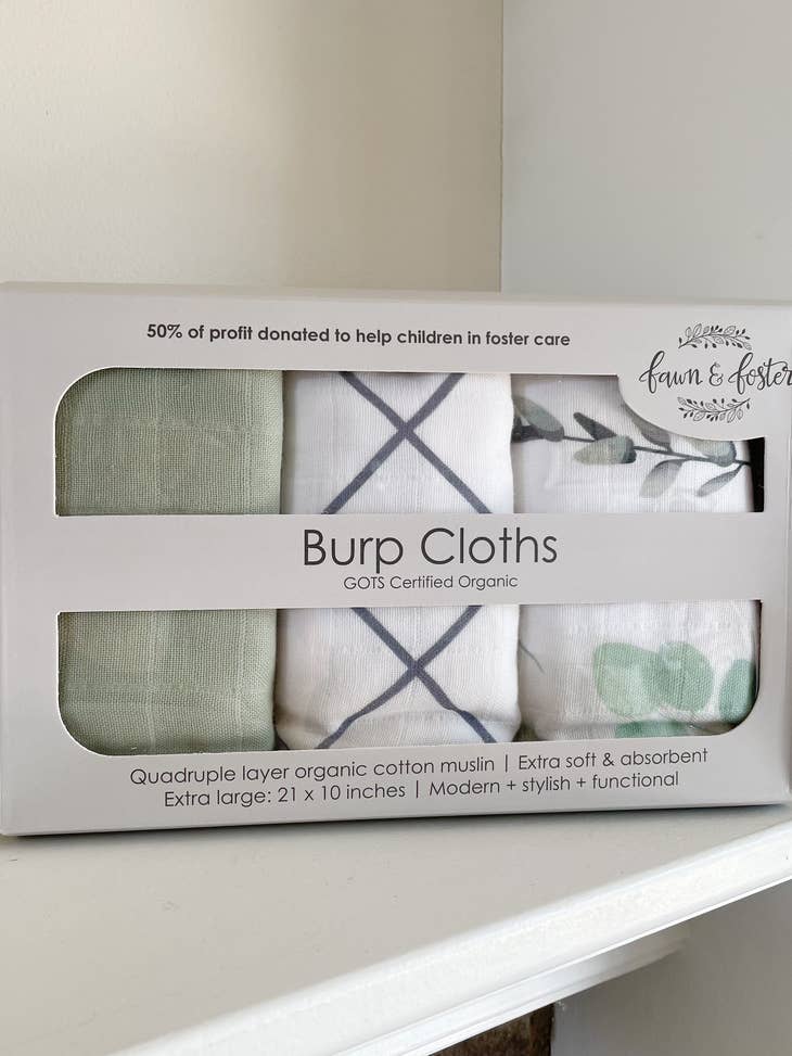 image of 3 pack pf organic cotton muslin burp cloths in product packaging by fawn and foster brand.