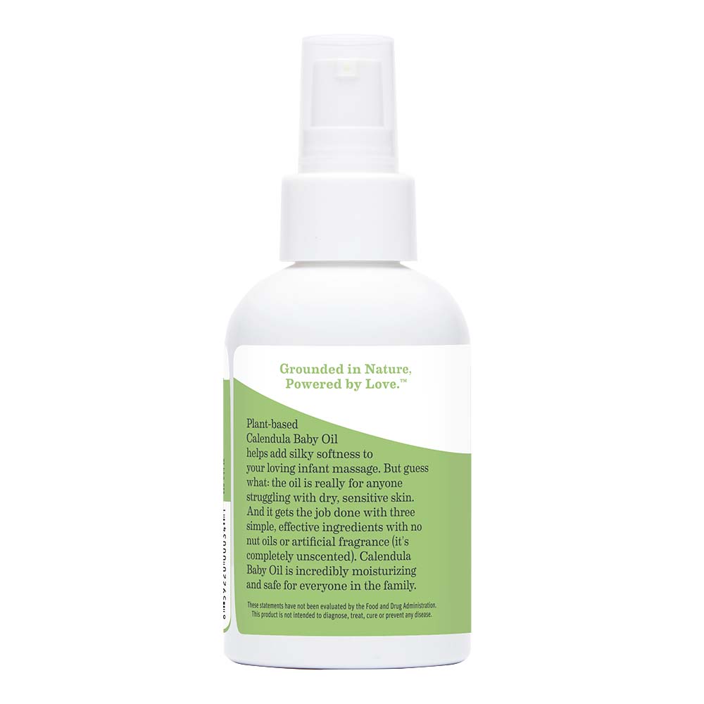 bottle of calendula baby oil with label explaining what to use it for and effective ingredients.