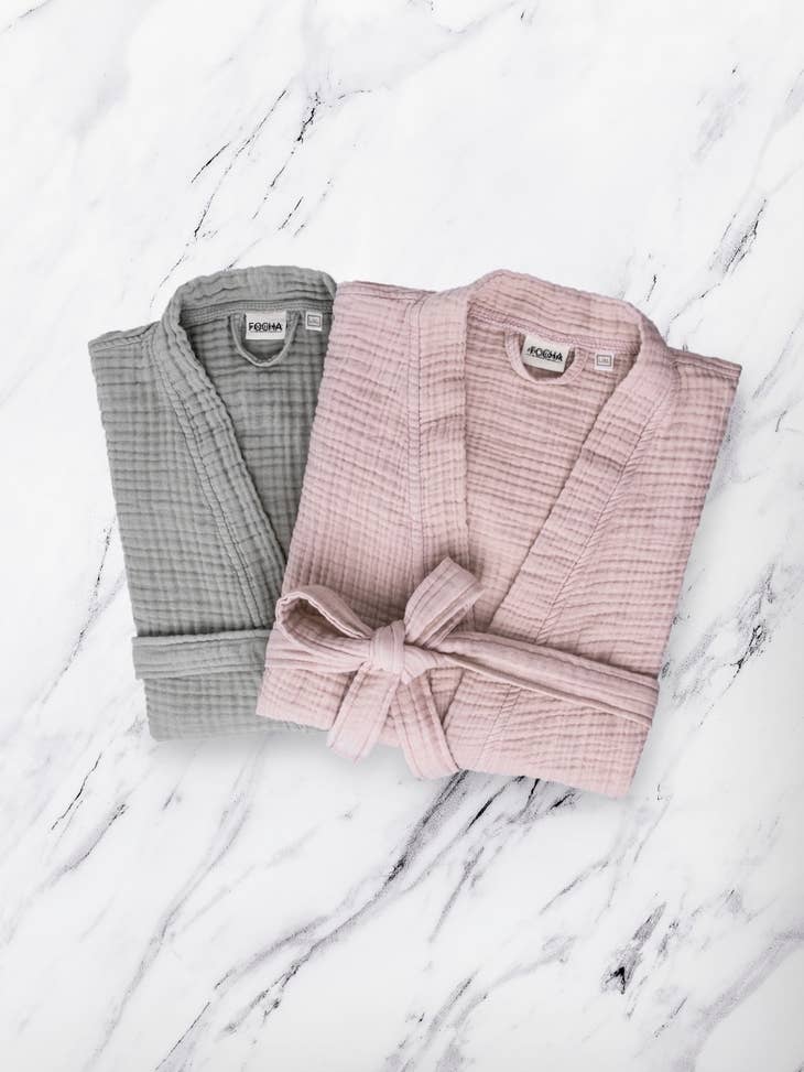 image of 2 muslin robes folded, one in rose color, one in gray color