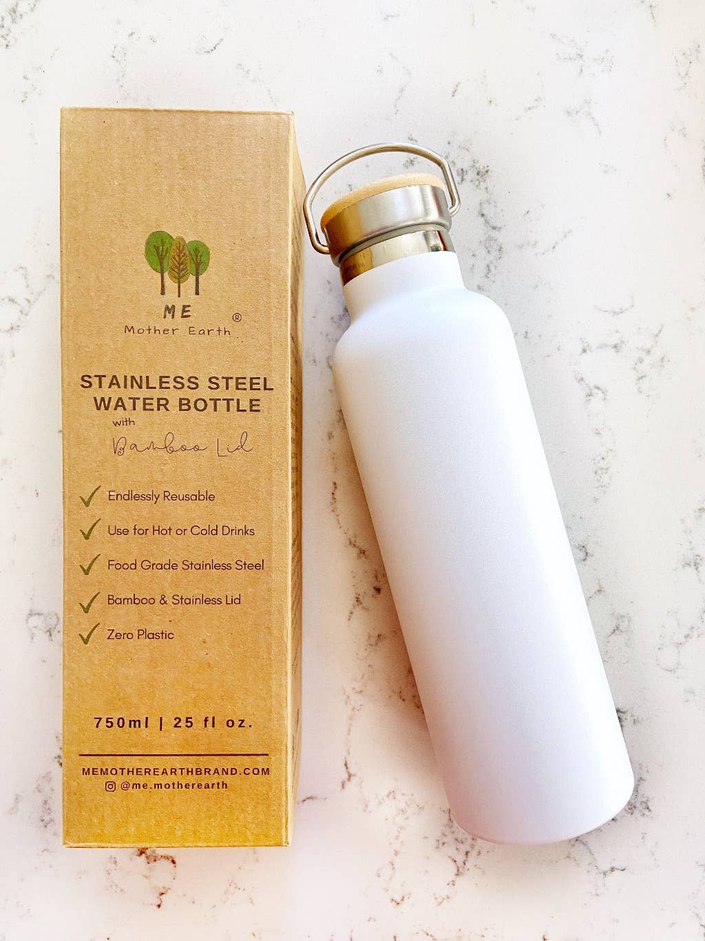 image of white stainless steal water bottle with bamboo and stainless steal lid, bottle packaging made of kraft paper next to it.