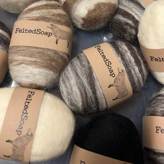 Image of wool felted soaps in natural colors with "Felted Soap" Label