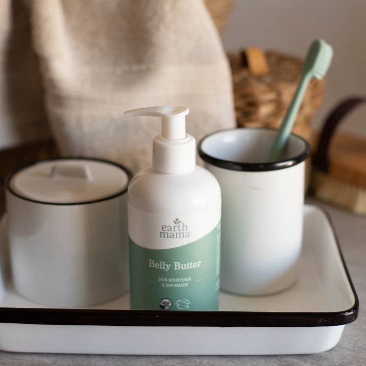 image of bottle of product on a vanity tray with toothbrush holder