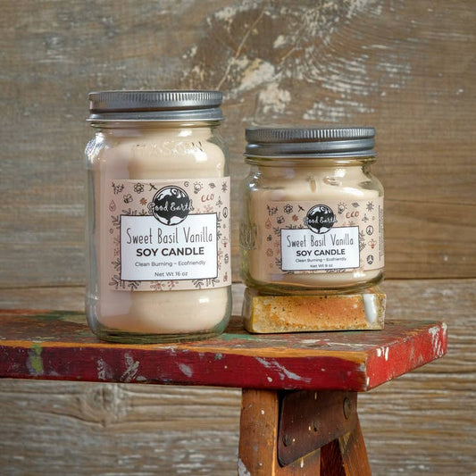 Image of Sweet Basil Vanilla scented soy candles in mason jars. Candles have a cream/tan tint. 