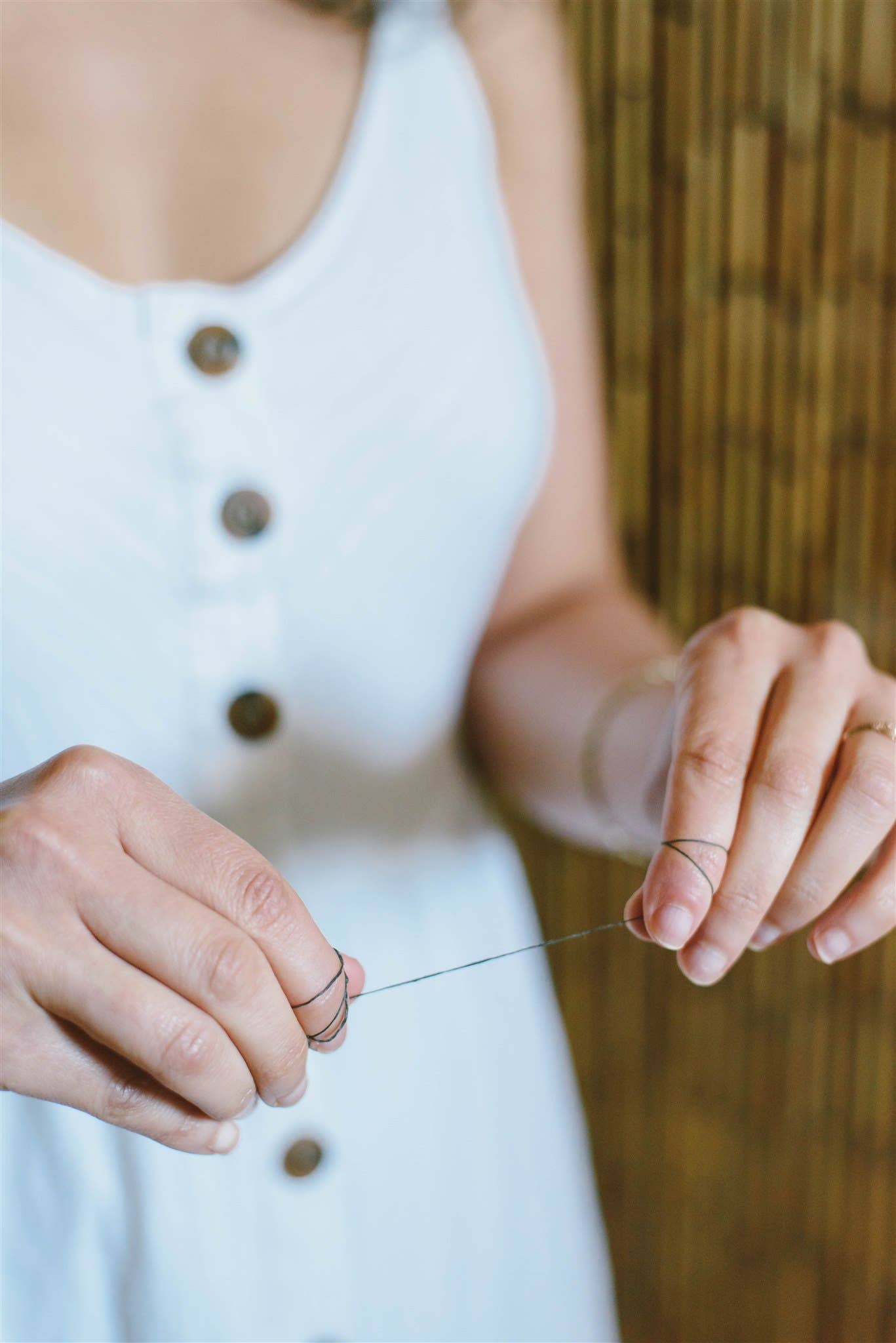 image of hands holding dental floss